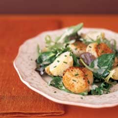 Seared scallops with new potatoes and field greens